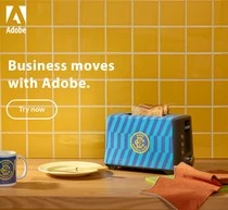 Blue striped toaster and plate on a wooden kitchen counter against yellow tiled wall by Anna Pagossova