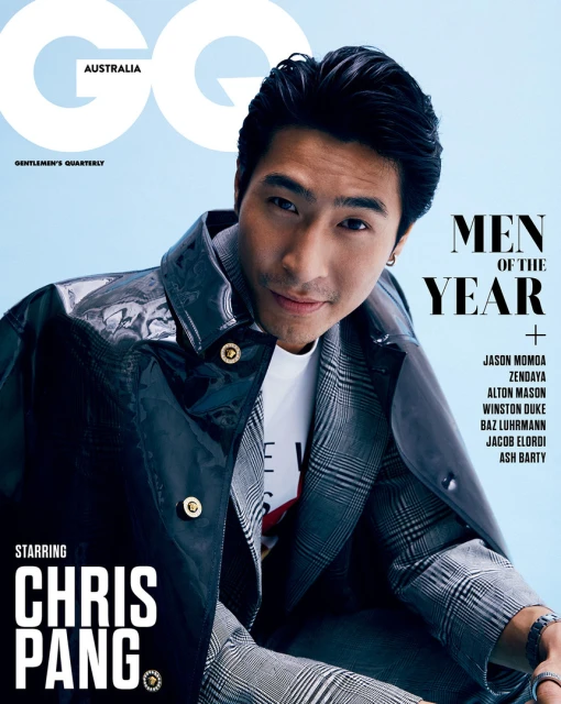 Magazine cover featuring a portrait of Chris Pang, an Asian male model, wearing a black patent leather coat and a plaid suit, against a blue background.