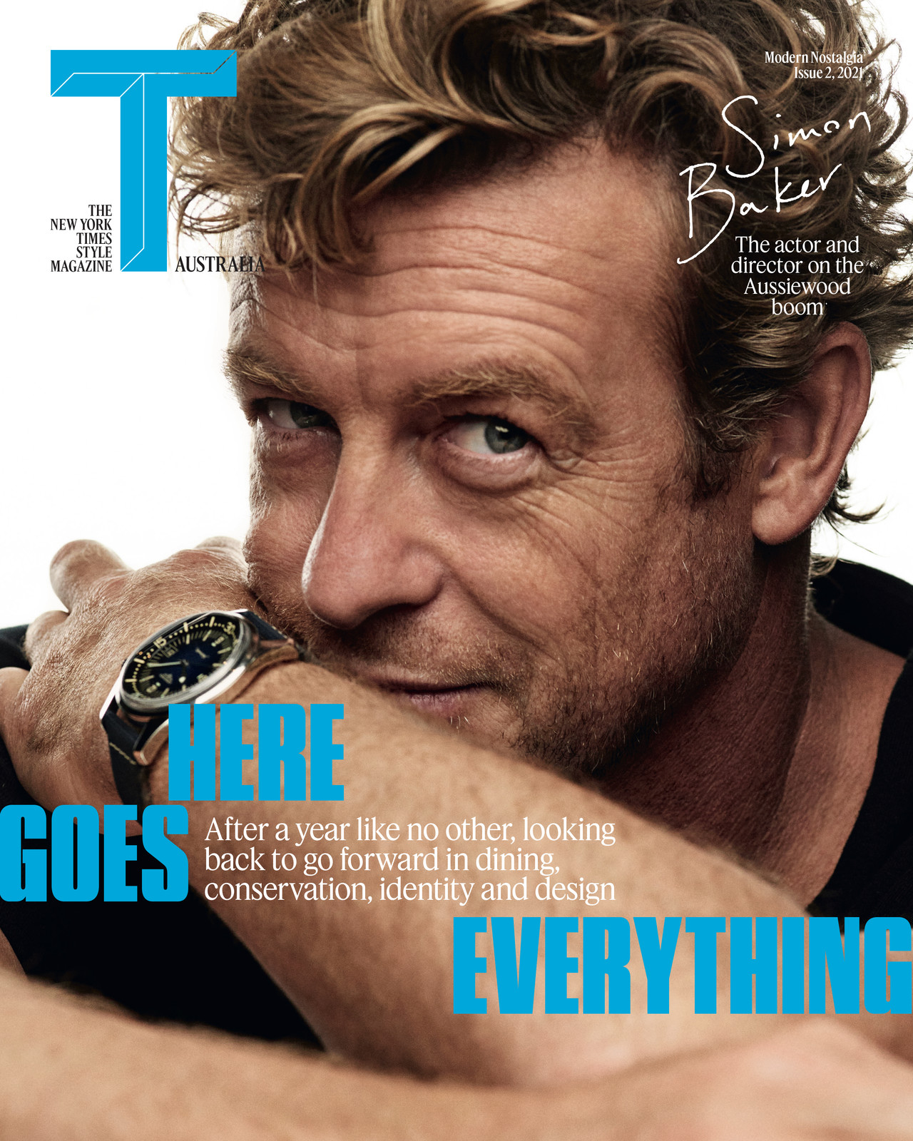 Magazine cover featuring Simon Baker, an actor, in a medium close-up shot. He is wearing a watch and resting his face on his hand.
