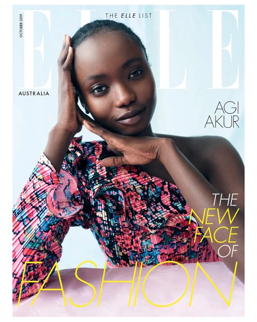 Elle Australia cover featuring Agi Akur in a floral one-shoulder dress on a light blue backdrop with yellow fashion text overlay.