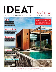Magazine cover featuring a modern architectural building next to a pool, with various text elements and country names: USA, France, etc.
