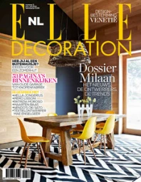 Elle Decoration magazine cover featuring a modern dining room interior with yellow chairs and wooden walls