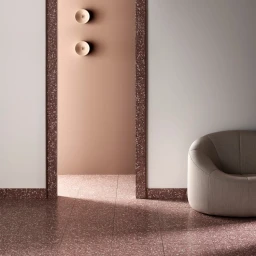 Modern interior styled by Bek Sheppard featuring a curved beige armchair on reddish-brown terrazzo flooring with matching wall trim