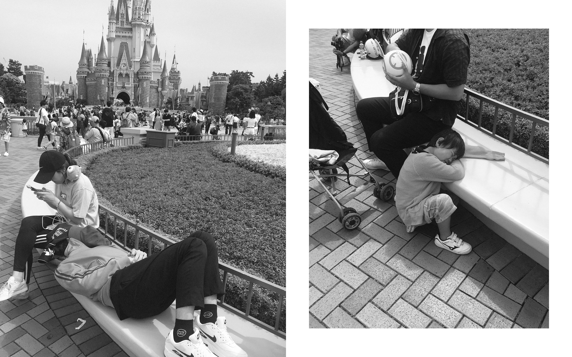 Monochrome image of people relaxing on benches near a castle and plants with a brick-paved walkway, capturing a travel or family scene.