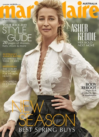 Magazine cover featuring Asher Keddie in a sheer floral top and tiered skirt, promoting spring fashion, against an outdoor backdrop.