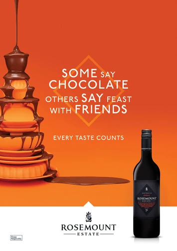 Chocolate fountain dripping onto plates with a bottle of Rosemount wine against an orange gradient background with text promoting the wine.
