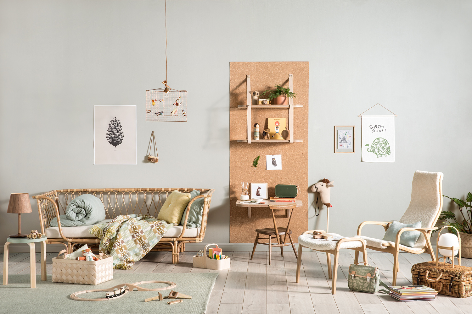 Child's room interior with rattan furniture, desk, chair, and toys in a pastel color palette, offering a warm, inviting atmosphere.