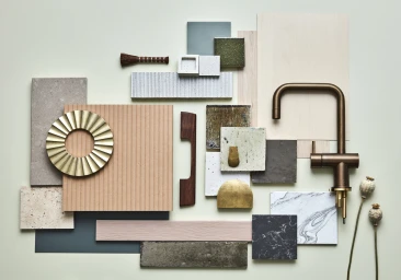 Flat lay material board featuring brass tapware, wood samples, stone tiles, and textured ceramic swatches by Jessica Hanson.