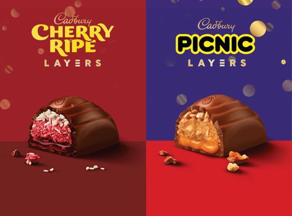 Two Cadbury chocolate blocks in red and blue with the text "Cherry Ripe Layers" and "Picnic Layers", revealing layered interiors.