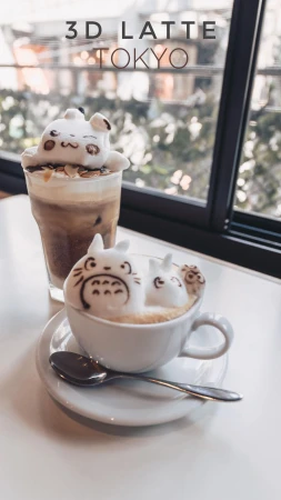 3D latte art featuring cute cartoon characters on coffee drinks in a bright cafe setting, Tokyo, Japan, near a window.