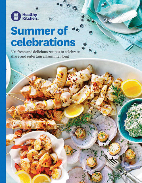 Overhead shot of seafood skewers, shrimp, scallops, lemons, and dill on white plates. Cookbook cover featuring recipes and a summer celebrations theme.