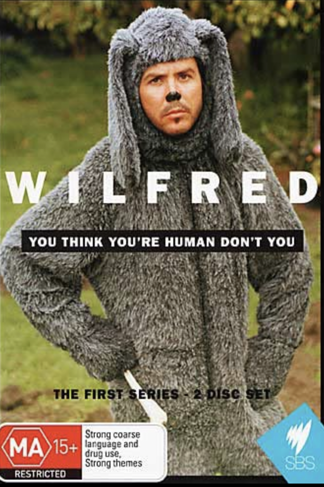 DVD cover art features an adult male in a furry dog costume in an outdoor setting, promoting the 'Wilfred' TV series.