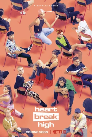 Group shot of young adults sitting on chairs against a vibrant orange backdrop for 'Heartbreak High' on Netflix, a coming-of-age series.