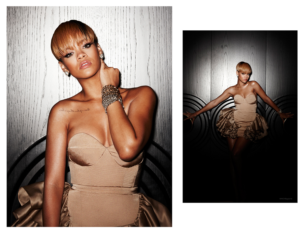 Close-up portrait of a woman with short blonde hair in a strapless golden dress, posing against a wall with dark wood panels and dim lighting.