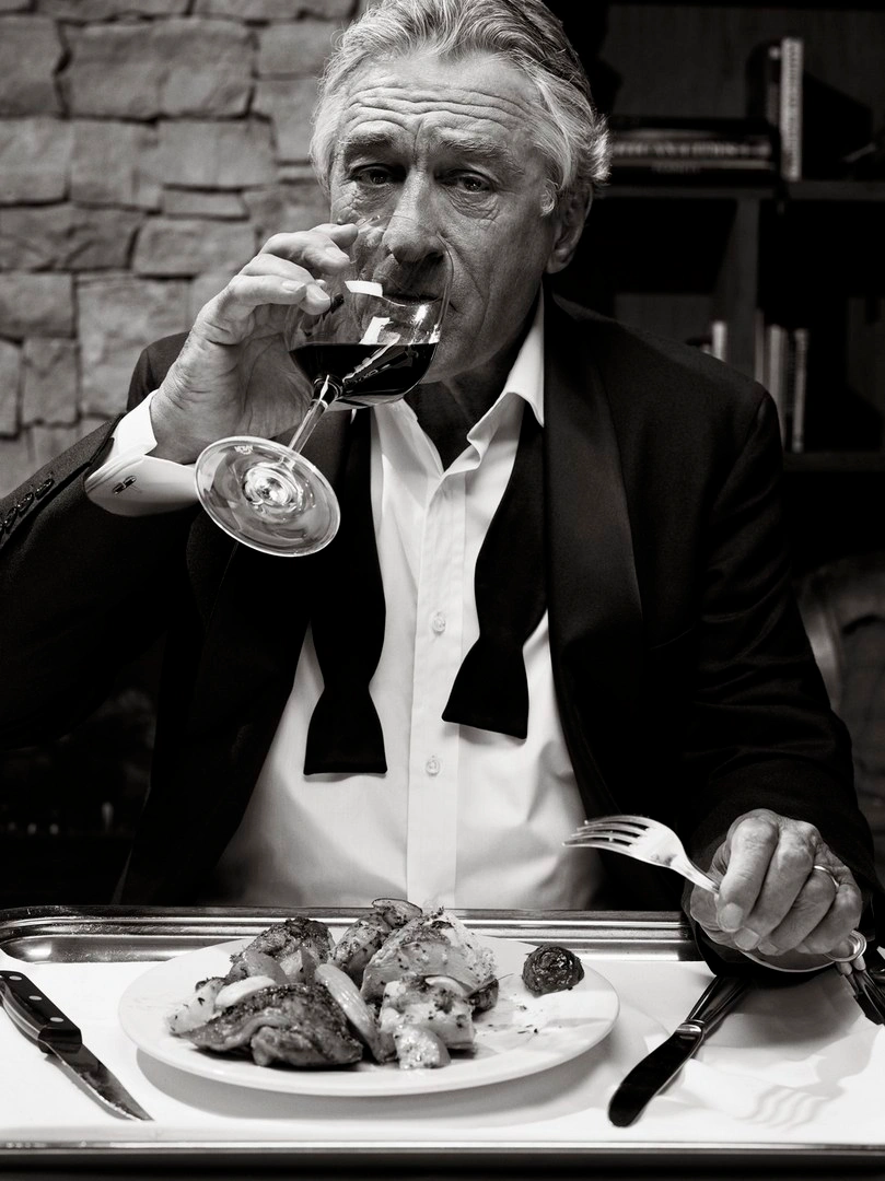 Robert De Niro in a tuxedo drinking wine by Robbie Fimmano