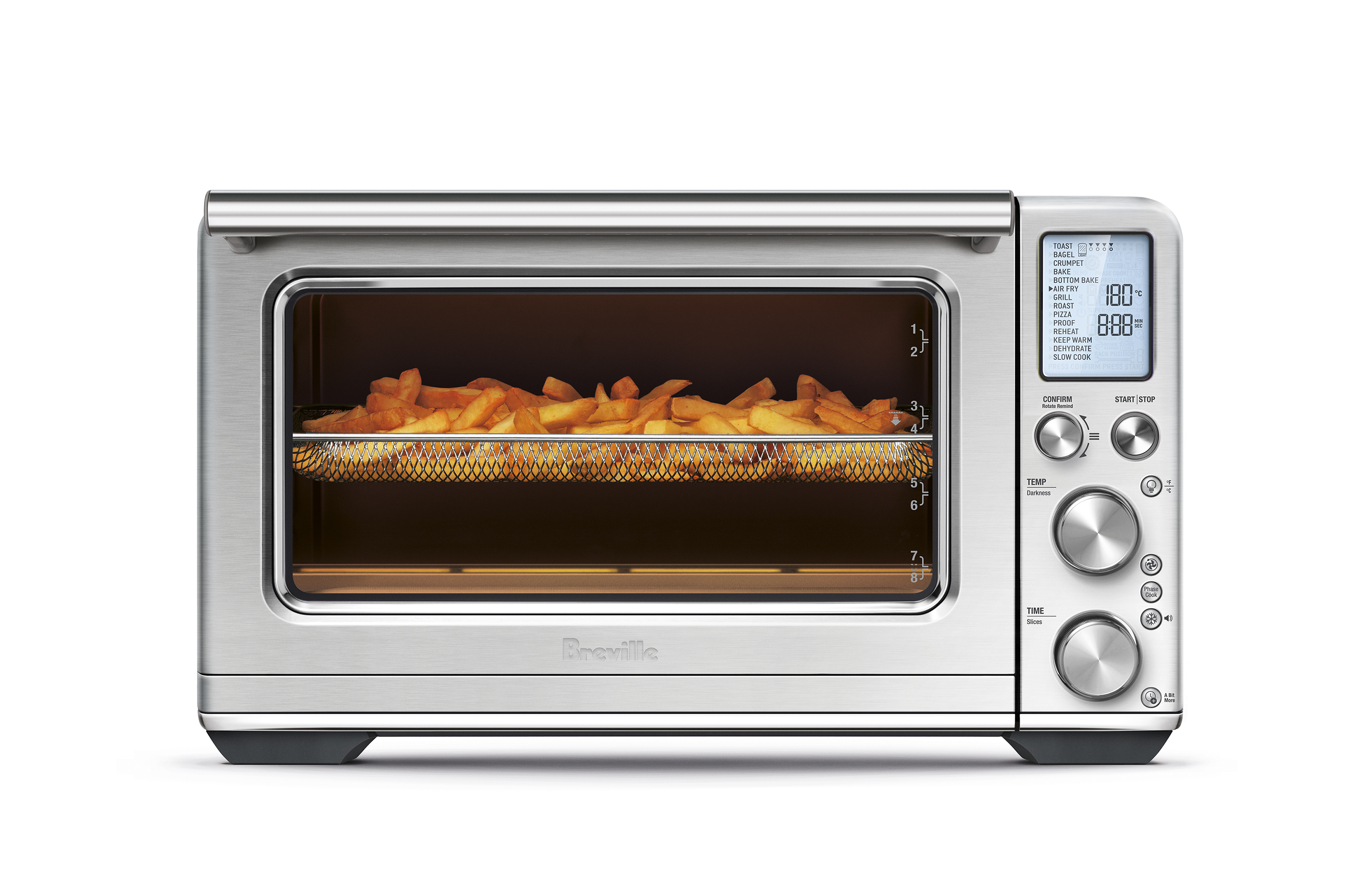 Stainless steel convection oven with air fry basket inside, filled with cooked french fries, front-facing on white background.