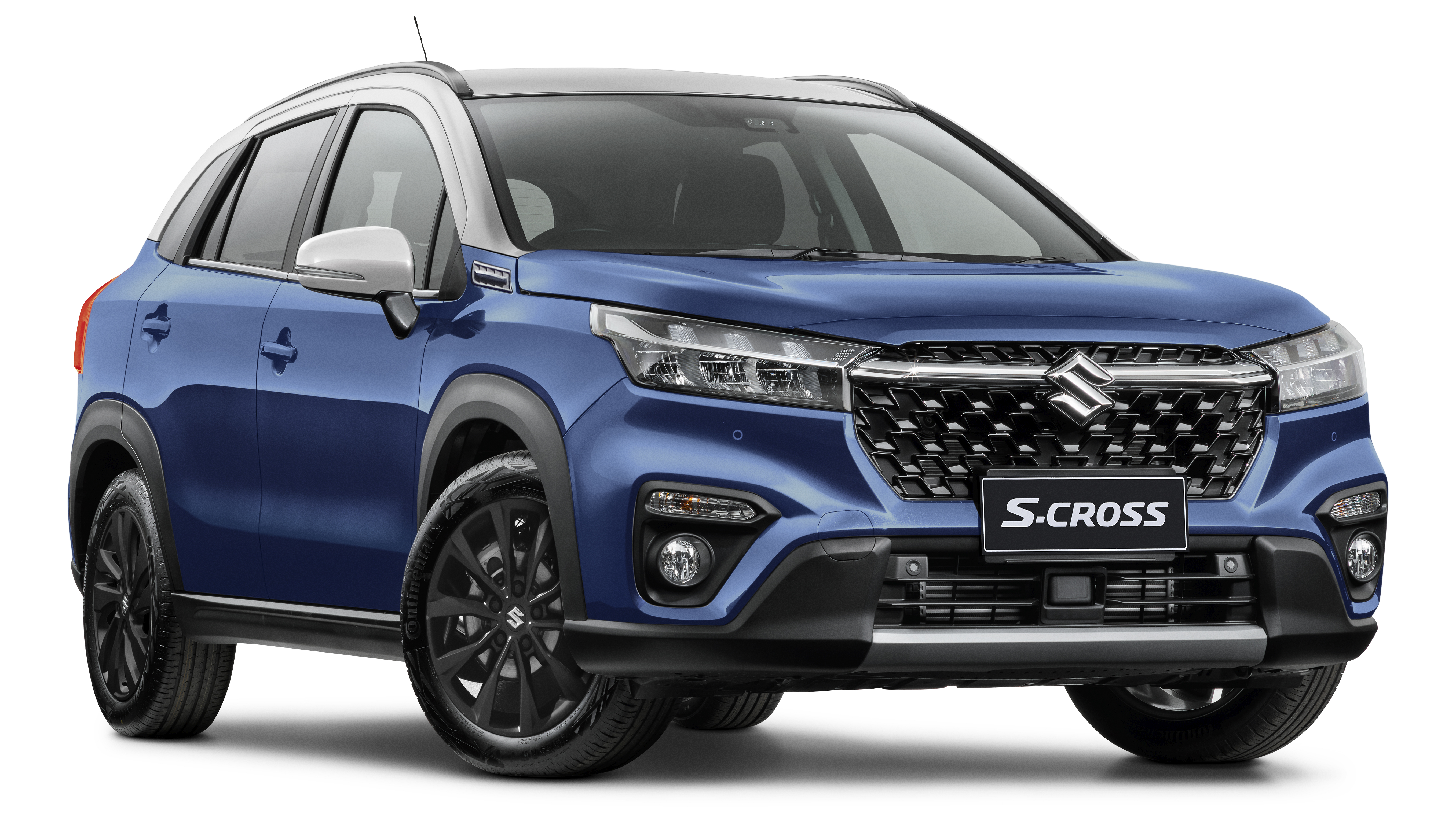 Blue Suzuki S-Cross SUV on a white background, showcasing its modern design and features, with black wheels and silver roof accents.