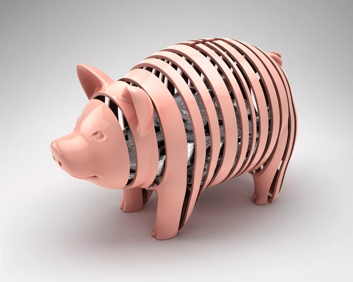 Glossy pink sliced piggy bank revealing stacked silver coins inside against a plain white background