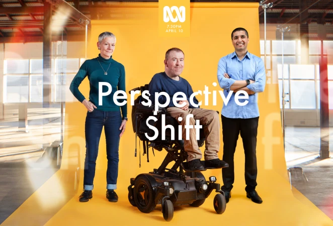Studio shot featuring two adults and one adult in a wheelchair against yellow backdrop, promoting 'Perspective Shift' program.