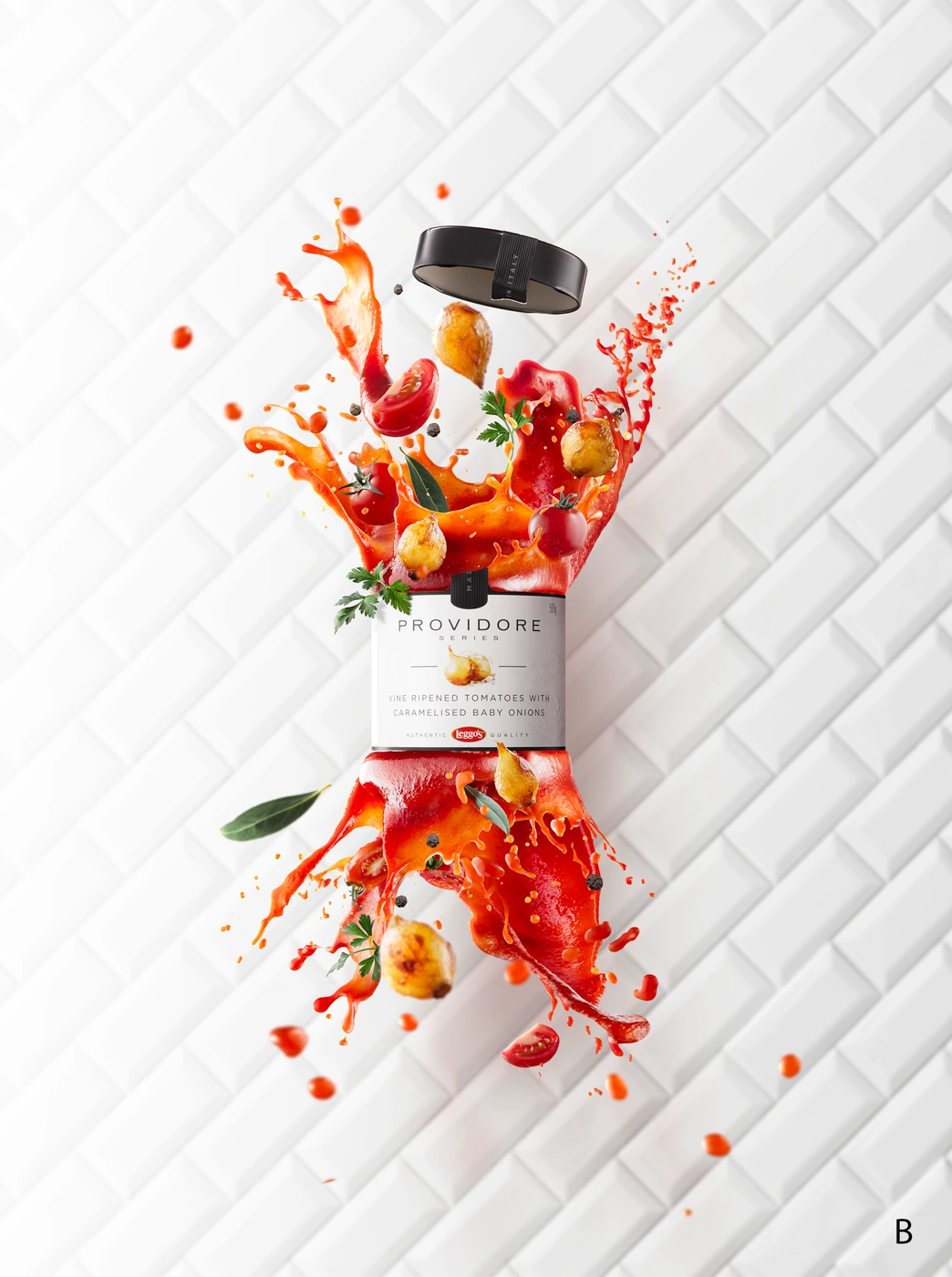 Jar of Providore sauce exploding mid-air with tomatoes, onions, and red liquid against a white tiled background.