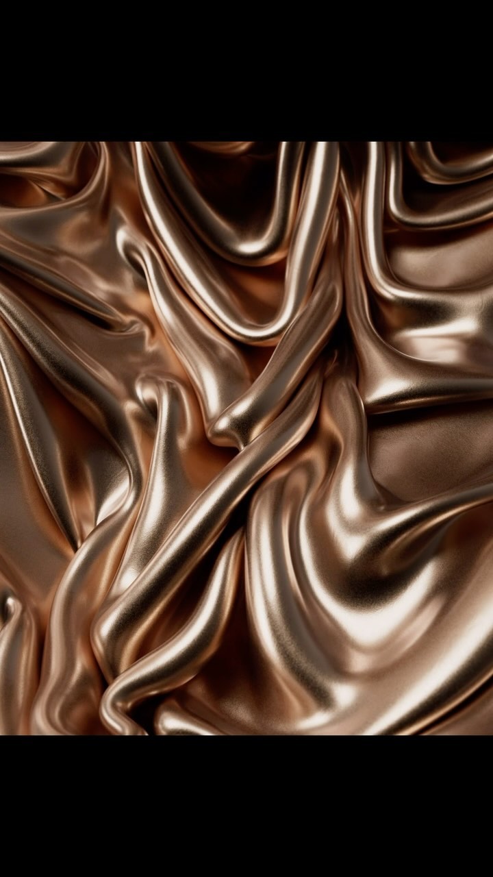 Abstract image of a draped, shiny gold fabric with smooth, flowing folds and a luxurious, elegant appearance against a dark background.