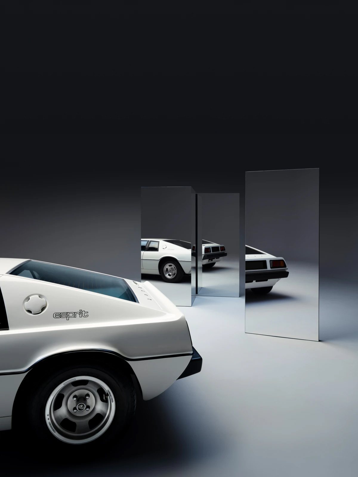 White Lotus Esprit Turbo rear view with mirrors reflecting car, studio lighting, automotive photography, clean aesthetic.