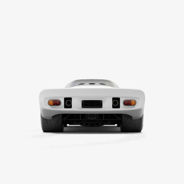 Rear view of a matte white sports car isolated on a white background with visible tires, exhaust pipes, and taillights.