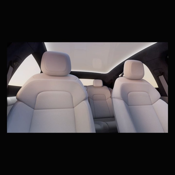 Car interior showcasing white leather seats under a panoramic sunroof, providing a spacious and luxurious automotive experience.