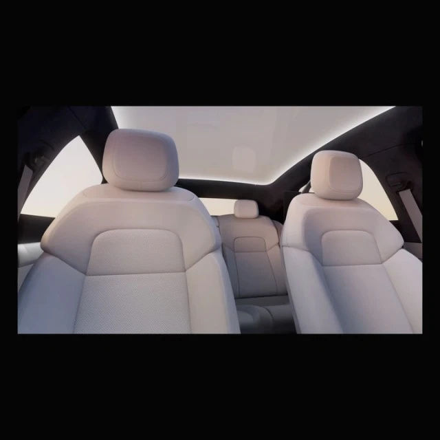 Car interior showcasing white leather seats under a panoramic sunroof, providing a spacious and luxurious automotive experience.