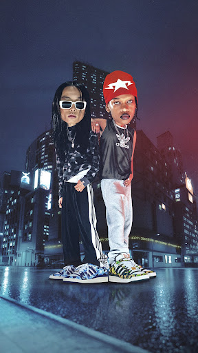 Two stylized figures stand in a city street with futuristic sneakers, one in black and white, the other in grey and orange.