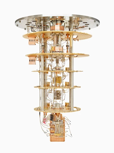 Intricate tiered metal framework with cylindrical supports and horizontal platforms, cables, and components against a clean white background.