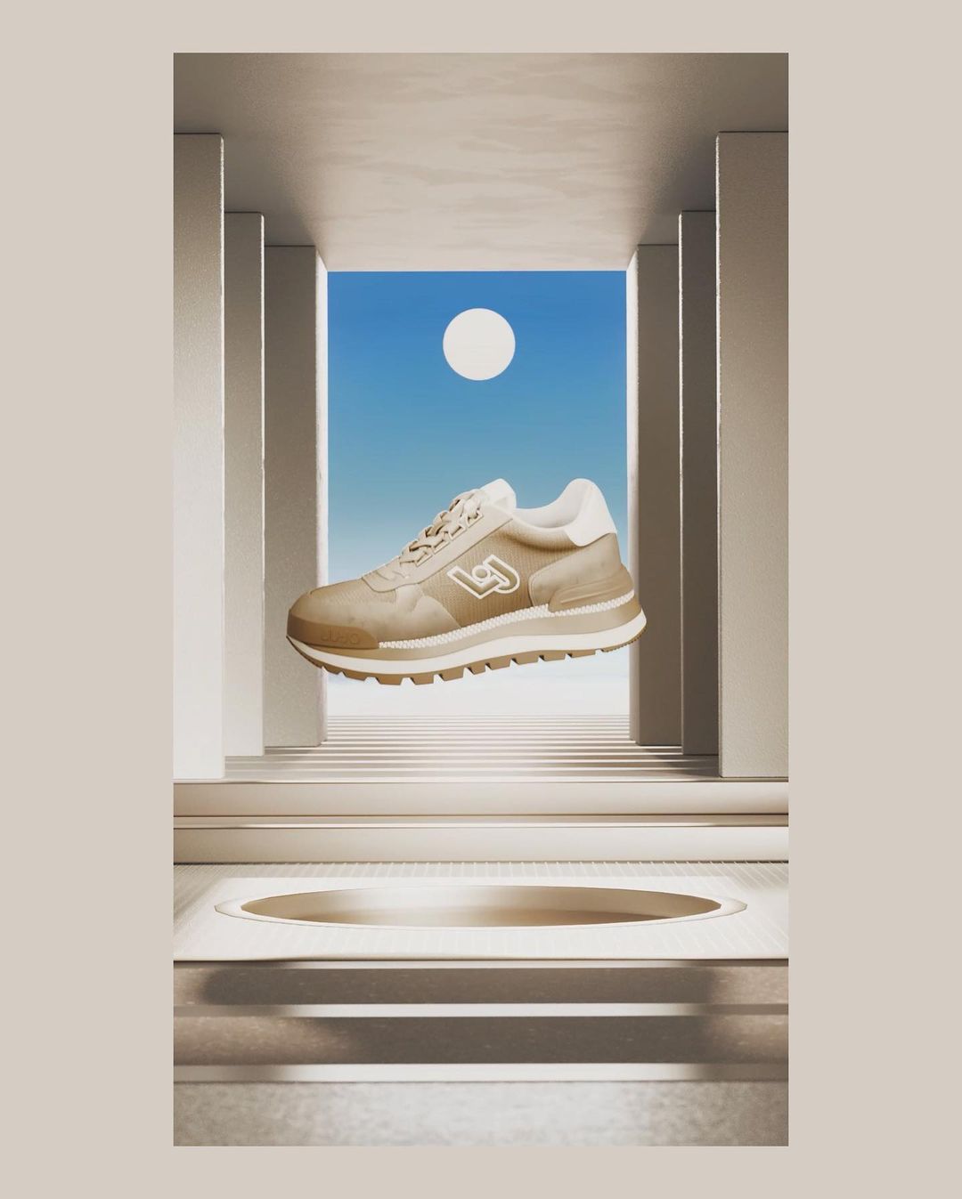 Beige Liu Jo sneaker hovers against a sky backdrop with white architectural elements. A modern, minimalist product shot.
