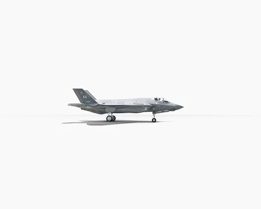 A gray F-35 fighter jet is centered on a white background. The plane has two engines, stealth features, and landing gear visible.