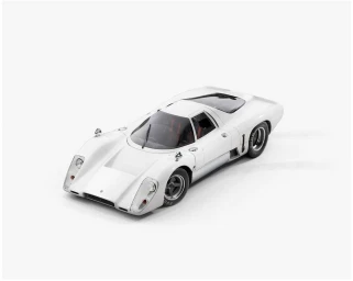 High-angle shot of a classic white sports race car parked against a clean white seamless studio background.