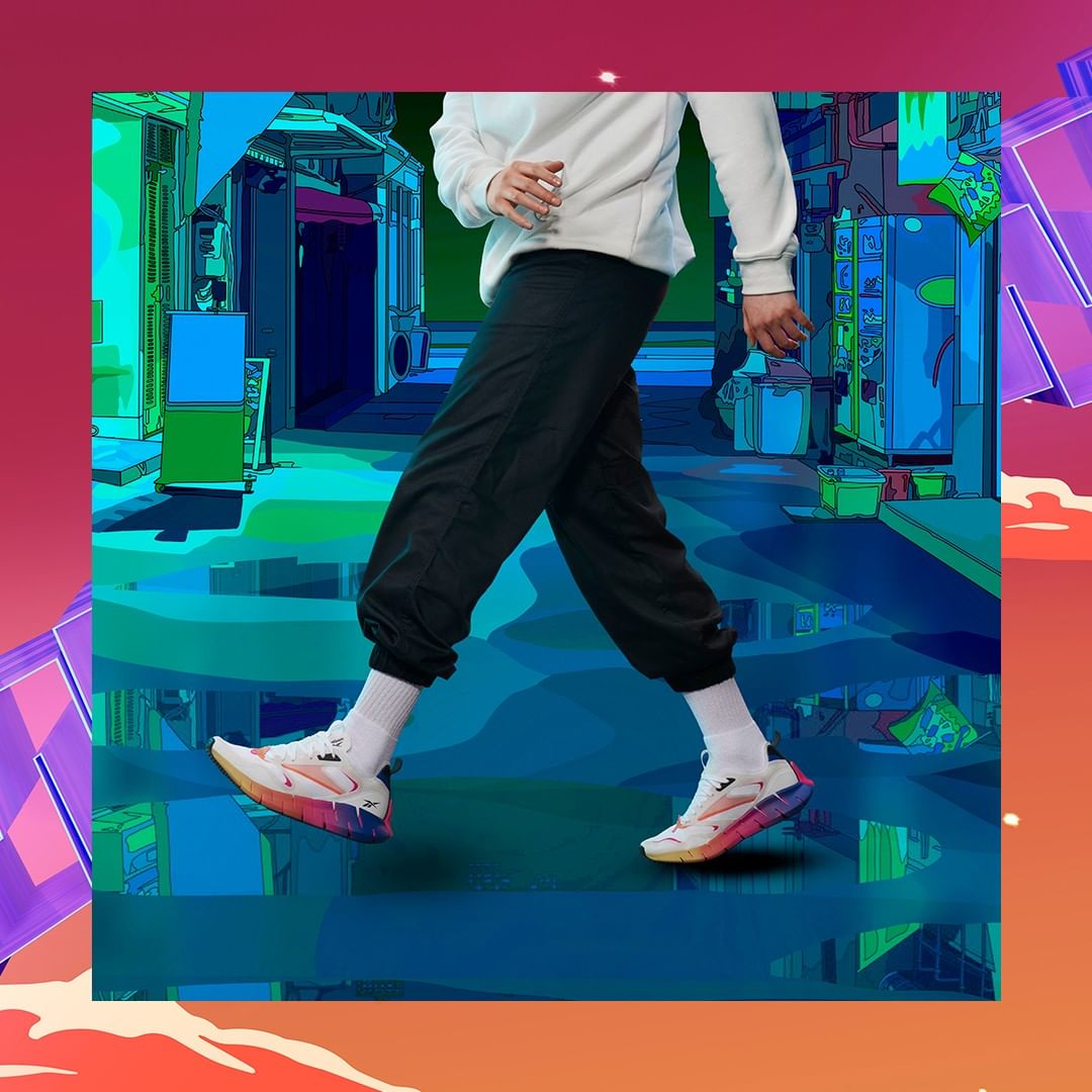 Person wearing white sweatshirt, black sweatpants, and white sneakers walks in front of an animated street. Cartoon background.