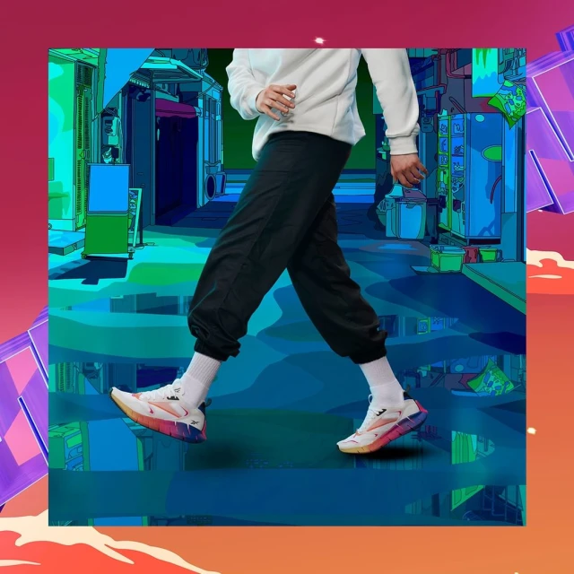 Person wearing white sweatshirt, black sweatpants, and white sneakers walks in front of an animated street. Cartoon background.