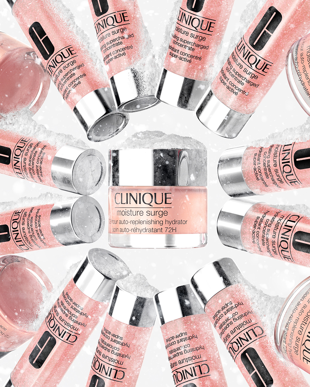 Clinique Moisture Surge skincare product containers arranged in a circle on a white background with snow-like texture, beauty concept