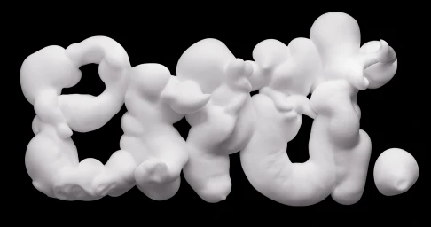 White foam typography forming the word read against a solid black background, created by CGI artist Tina Touli.