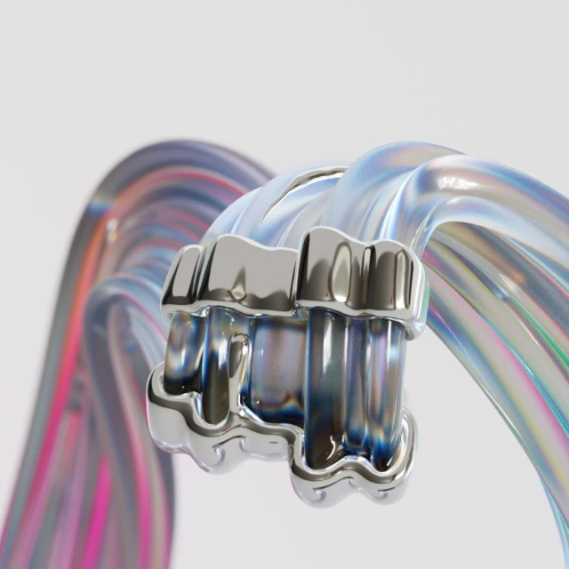 Close-up of a mouthguard-like dental appliance with iridescent accents connected by a clear iridescent band on a white background.