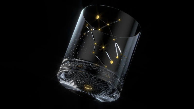 Crystal glass with constellation design against a black background, shot with studio lighting for product marketing material, shiny and elegant.