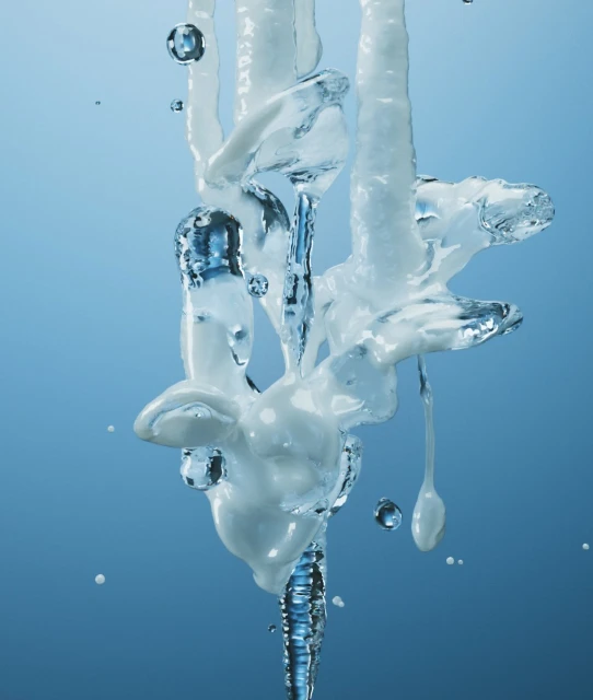 Abstract close-up of transparent ice formation with frozen liquid drips on a gradient blue background. Cool, cold, frozen.