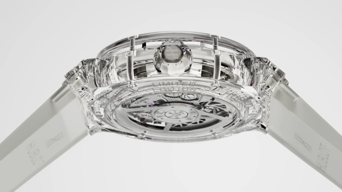 Transparent Hublot watch with visible movement, showcasing intricate mechanics and design against a clean, bright background, luxury timepiece.