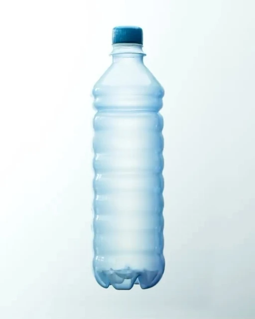 Clear plastic water bottle with a blue cap, isolated against a light blue background, showing its shape and design.
