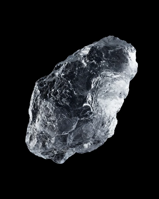 Translucent mineral specimen on black. Close-up studio shot of rock crystal mineral with crystalline texture against dark background.
