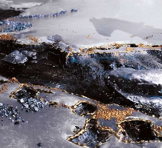 Abstract digital rendering features metallic textures, gold and blue accents, and unique patterns, creating a luxurious background image.