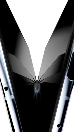 Abstract close-up of folded smartphone with reflective surfaces, creating a symmetrical, futuristic design against a bright white backdrop.