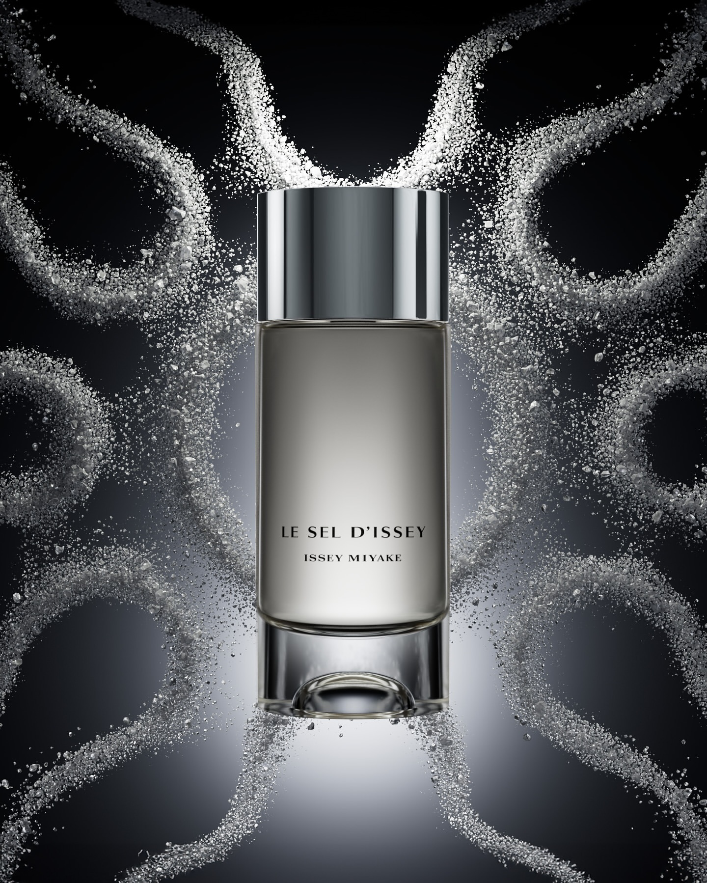 Bottle of Le Sel d'Issey Issey Miyake perfume with a gray-silver bottle and cap, surrounded by white powder against a dark background.