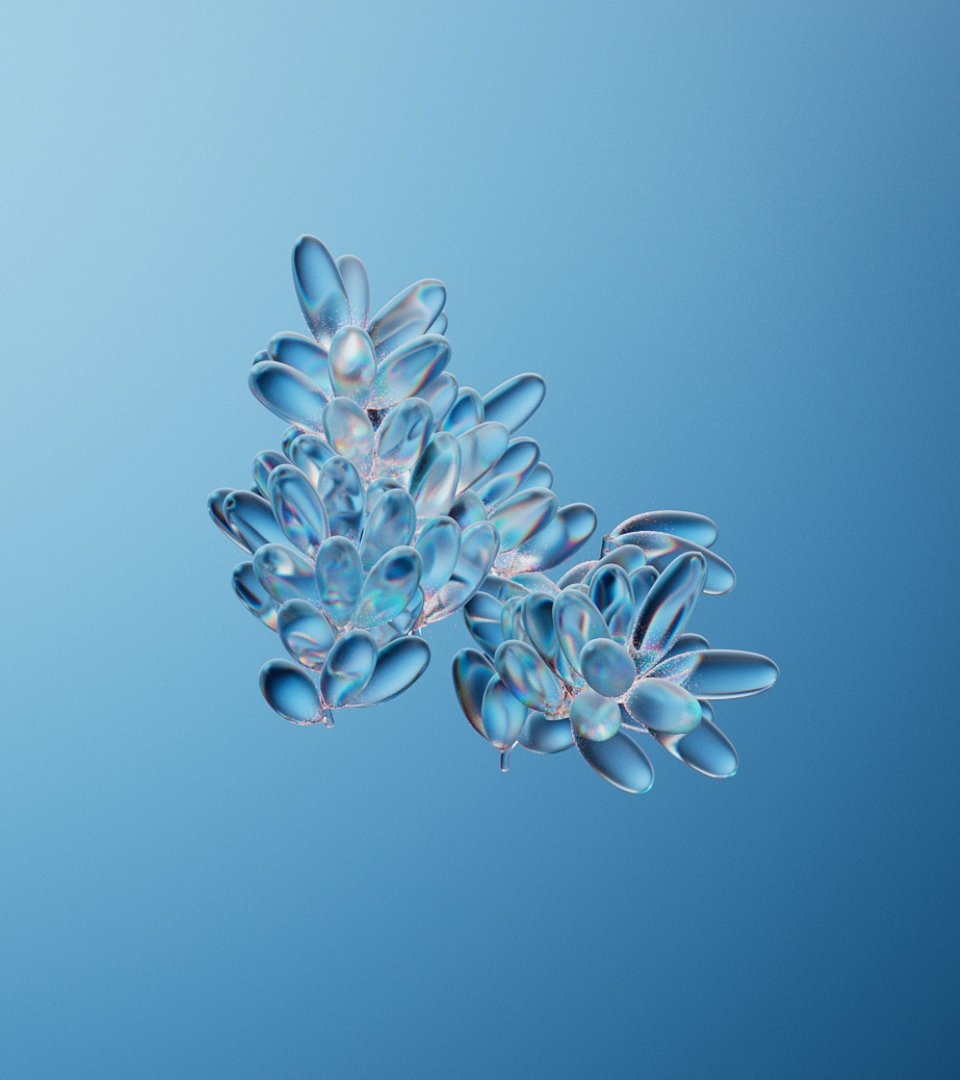 Close-up of translucent structures resembling blue crystals clustered on a softly graduated light blue background, showcasing intricate detail.