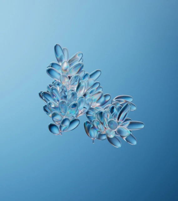 Close-up of translucent structures resembling blue crystals clustered on a softly graduated light blue background, showcasing intricate detail.