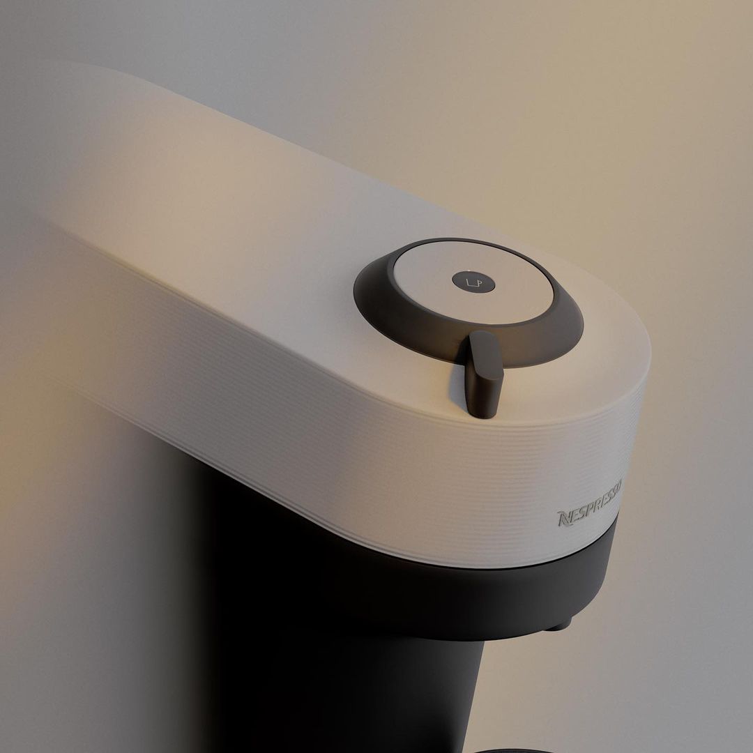White and black Nespresso coffee machine on a neutral background, showcasing its sleek design and functionality for home or office use.